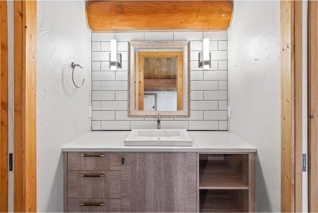 bathroom featuring decorative backsplash and vanity