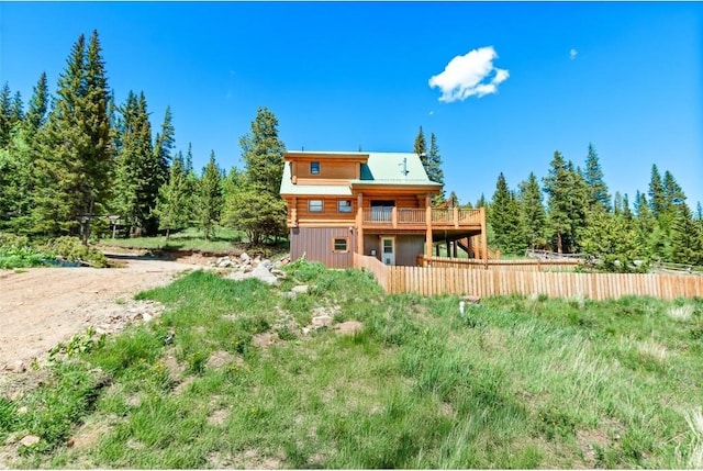 back of house featuring a wooden deck