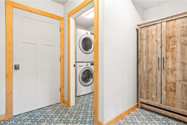 laundry area featuring stacked washer and clothes dryer