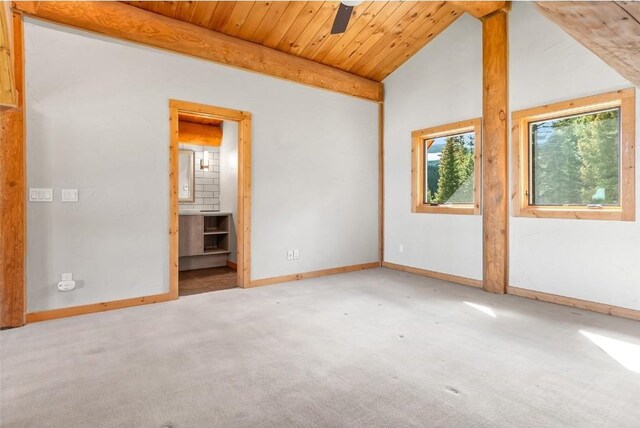 empty room with ceiling fan, carpet floors, wooden ceiling, and lofted ceiling