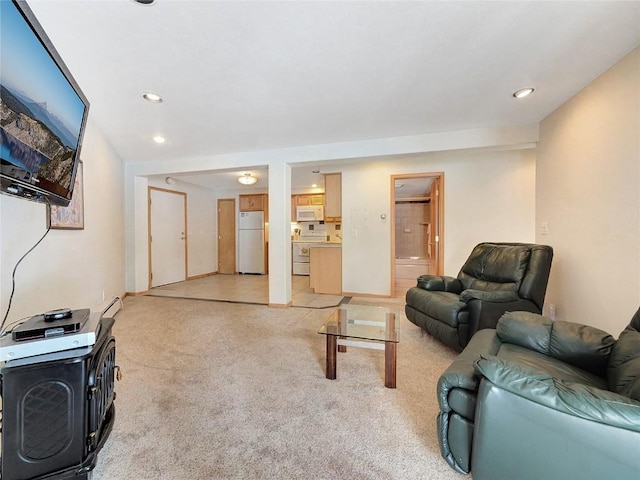 living room with light carpet and a baseboard radiator