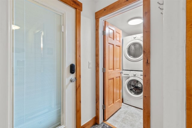 washroom featuring stacked washer and dryer