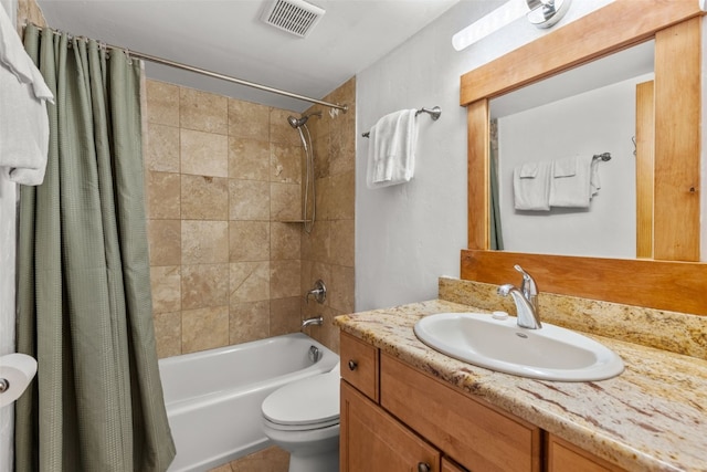 full bathroom with shower / bath combination with curtain, vanity, and toilet