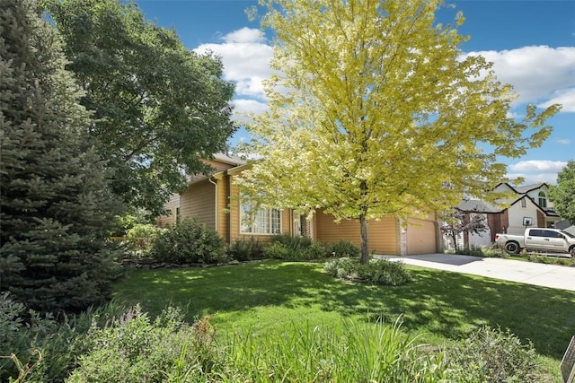 view of property hidden behind natural elements with a front yard