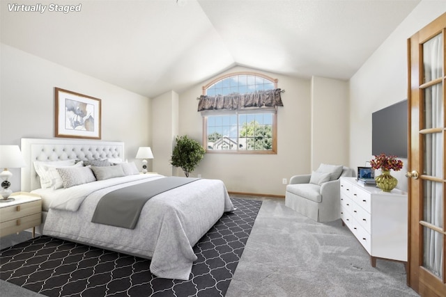 carpeted bedroom featuring vaulted ceiling