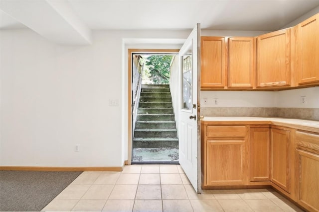 kitchen with light tile patterned flooring