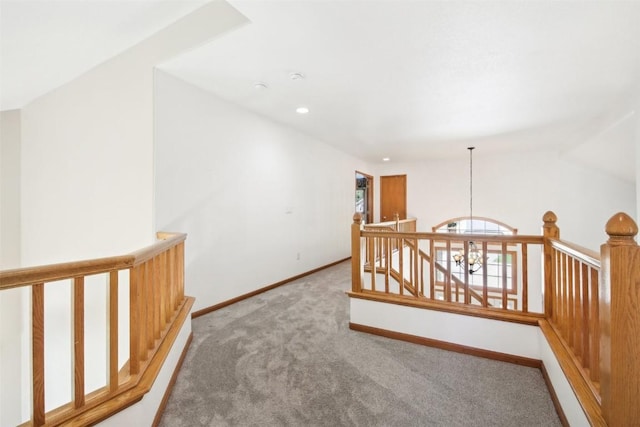 hallway with carpet floors