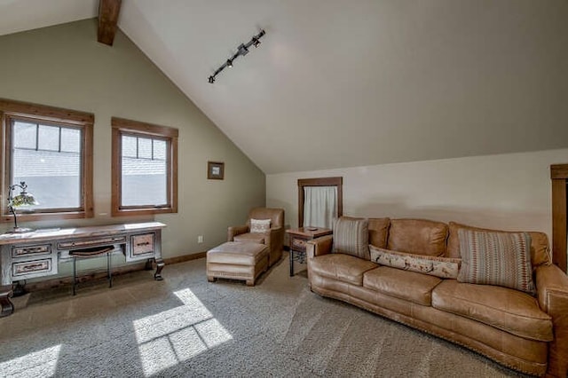 carpeted living room featuring vaulted ceiling with beams and rail lighting