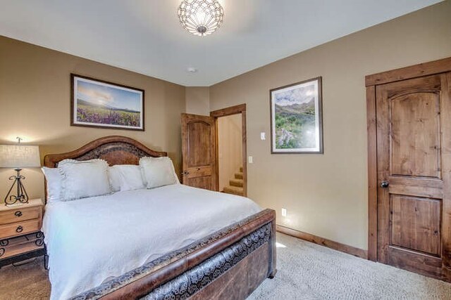 bedroom featuring light colored carpet