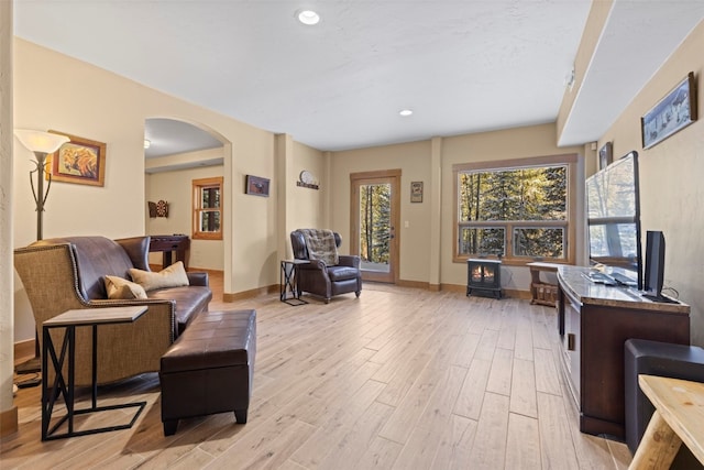 living room with light hardwood / wood-style flooring