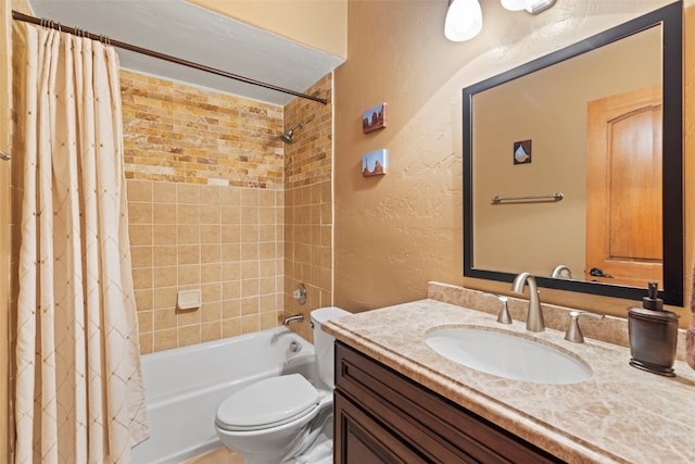 full bathroom featuring shower / bath combination with curtain, vanity, and toilet