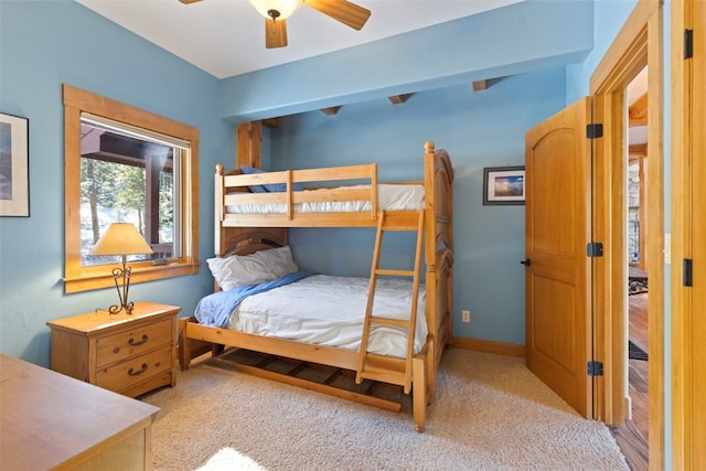 bedroom with ceiling fan and light colored carpet