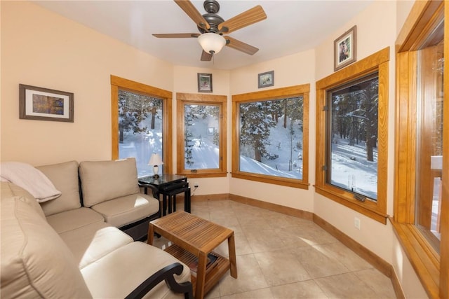 tiled living room with ceiling fan