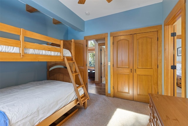 bedroom with light carpet, a closet, and ceiling fan