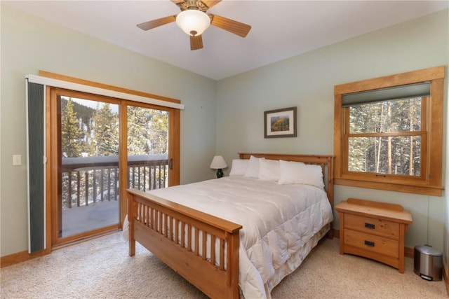 carpeted bedroom with access to outside and ceiling fan