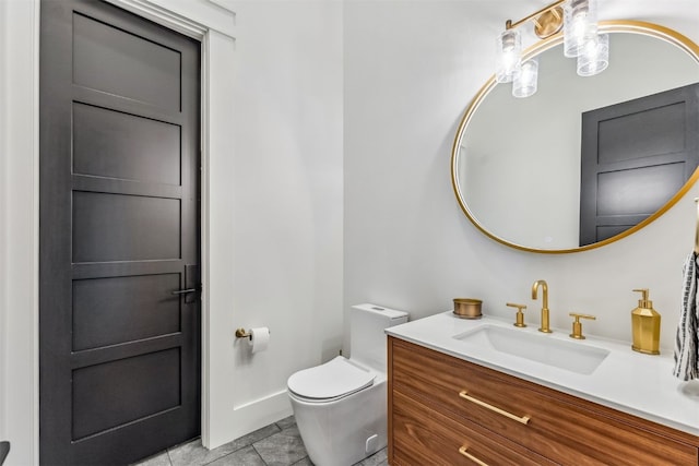 bathroom featuring tile patterned floors, vanity, and toilet