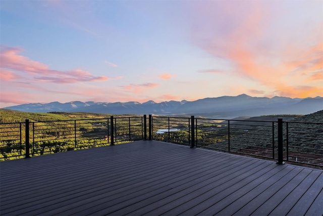 deck at dusk with a mountain view