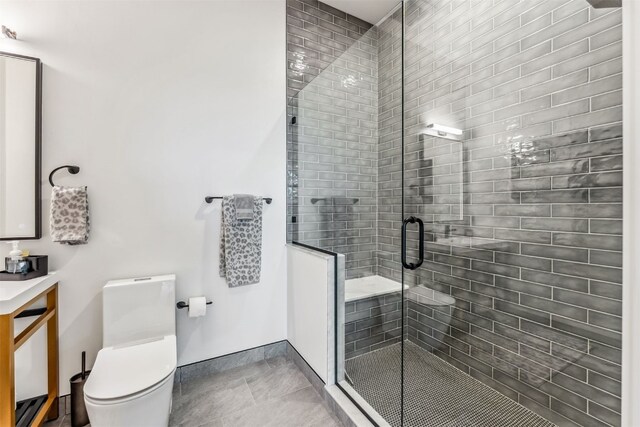 bathroom with walk in shower and toilet