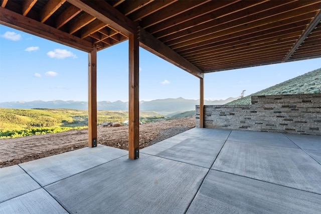 view of patio / terrace featuring a mountain view