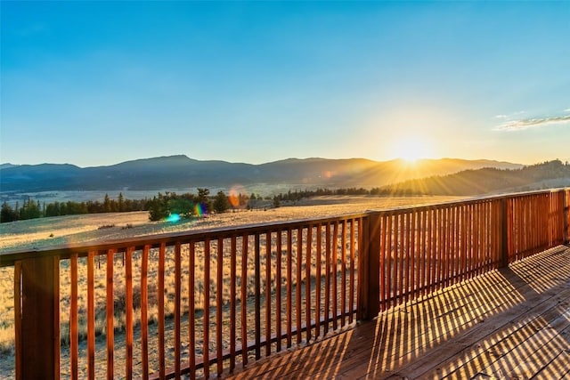 deck at dusk with a mountain view