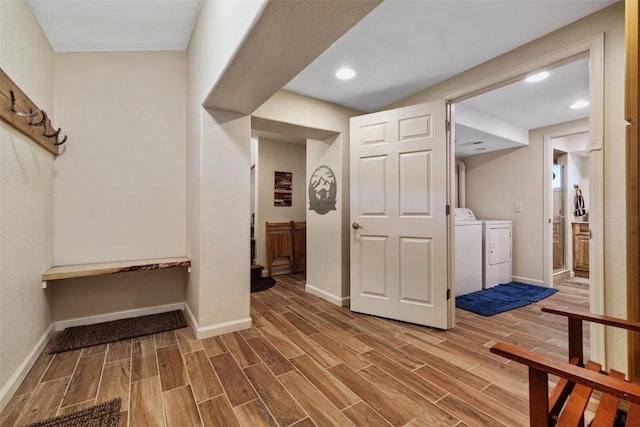 hallway with independent washer and dryer