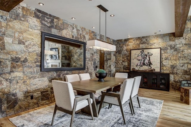 dining area with light hardwood / wood-style floors