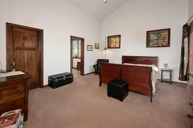 carpeted bedroom featuring high vaulted ceiling