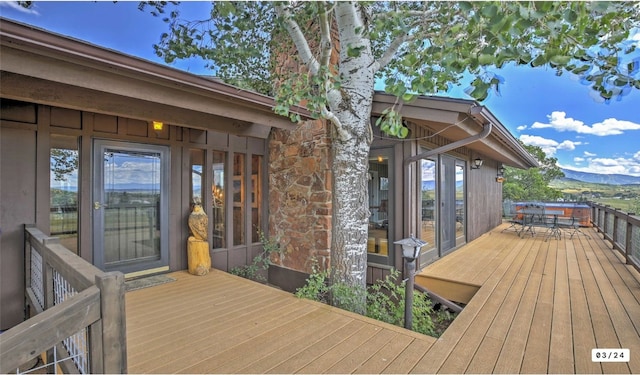 wooden deck with outdoor dining space