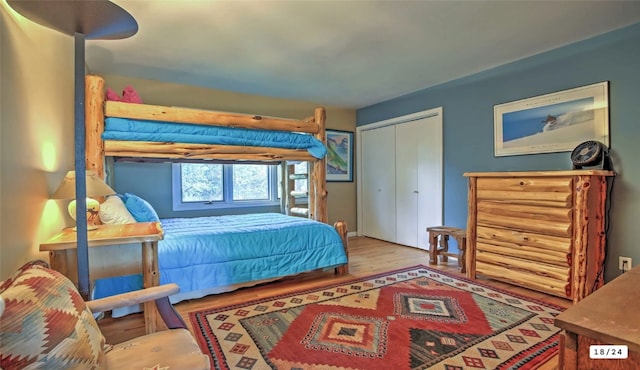 bedroom with a closet and wood finished floors