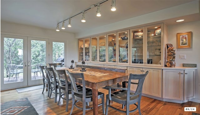 dining area with recessed lighting, light wood-type flooring, and french doors