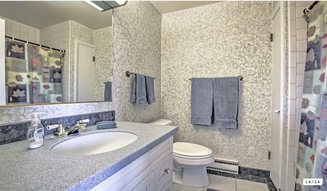 bathroom featuring tile patterned flooring, wallpapered walls, a baseboard heating unit, toilet, and vanity