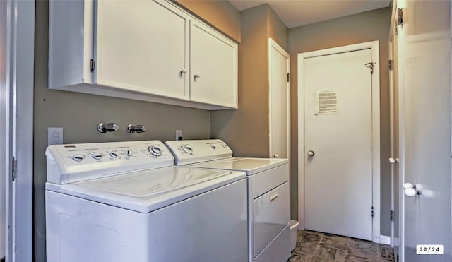 laundry room with cabinet space and washing machine and clothes dryer