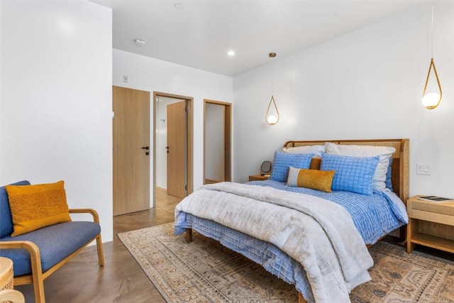 bedroom featuring concrete flooring