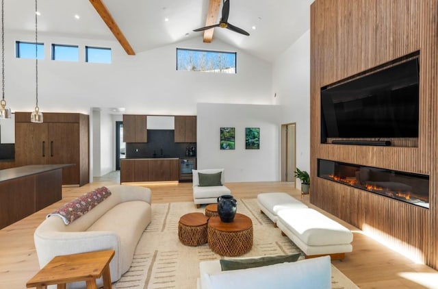 living room with high vaulted ceiling, ceiling fan, a fireplace, beamed ceiling, and beverage cooler