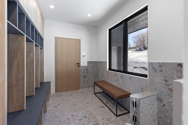 mudroom featuring tile walls