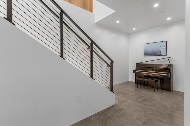 stairway with concrete floors