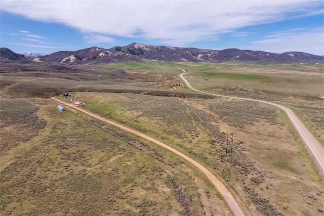 drone / aerial view featuring a mountain view