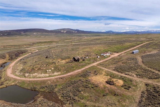 aerial view with a rural view and a water and mountain view