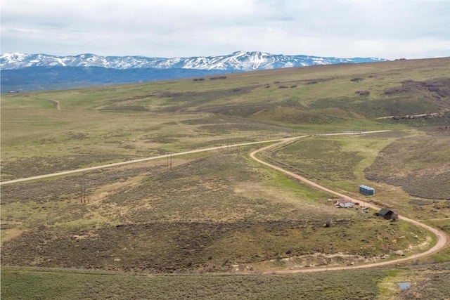 drone / aerial view with a mountain view and a rural view