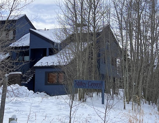 view of snow covered property