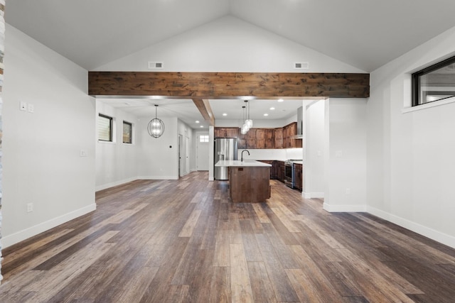 unfurnished living room featuring sink, dark wood-type flooring, and lofted ceiling