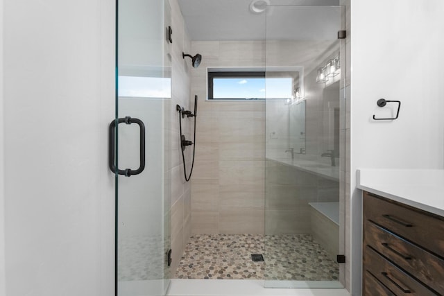 bathroom with vanity and an enclosed shower