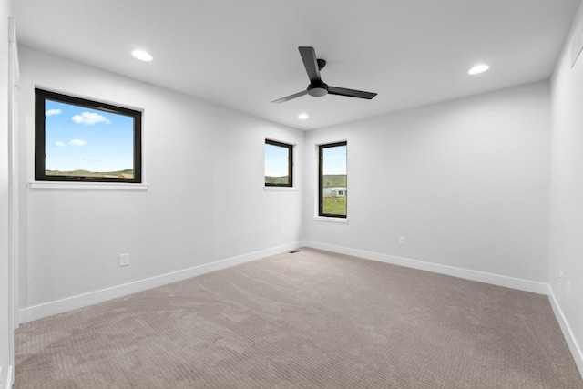 carpeted empty room with ceiling fan