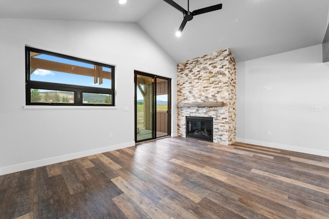 unfurnished living room with a fireplace, hardwood / wood-style flooring, high vaulted ceiling, and ceiling fan