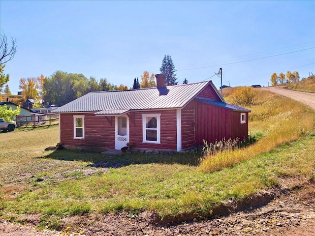 ranch-style home with a front lawn