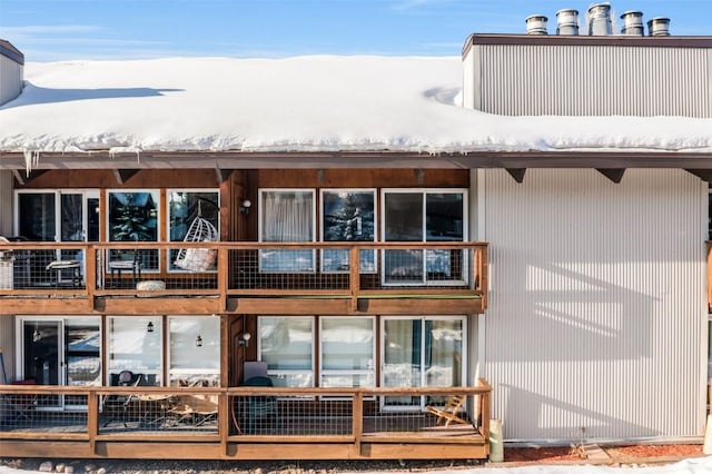 view of snow covered house