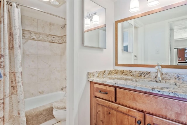 full bathroom with shower / bath combo, vanity, and toilet