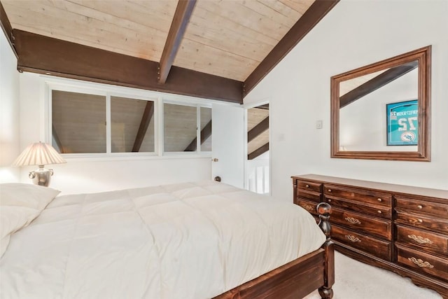 bedroom with vaulted ceiling with beams and wood ceiling