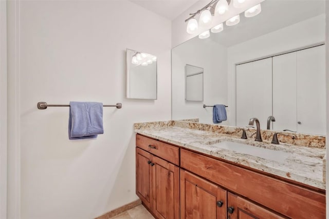 bathroom with tile patterned flooring and vanity