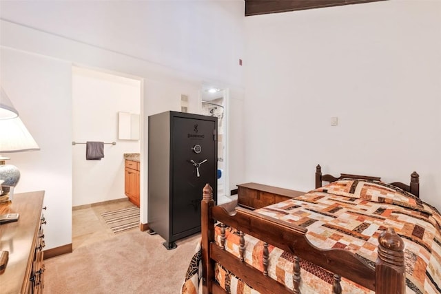 carpeted bedroom featuring connected bathroom